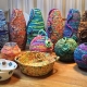 brightly coloured coiled fabric pots by Maggie Bush