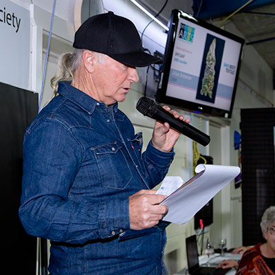 Fine Art Judge Robert Knight speaking at the 2022 Spring Art Show Opening