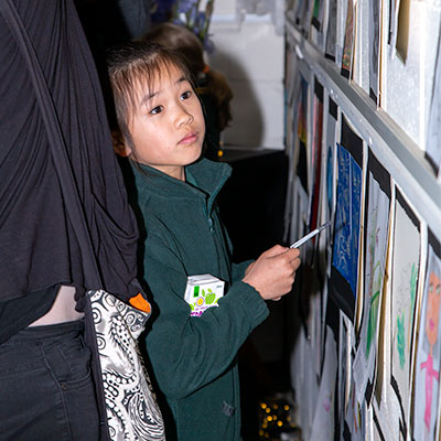 2022 Spring Art Show Childrens' Art Exhibition - child viewing artwork