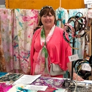 Jan Barbieri at Hastings Craft Expo with a selection of textile art