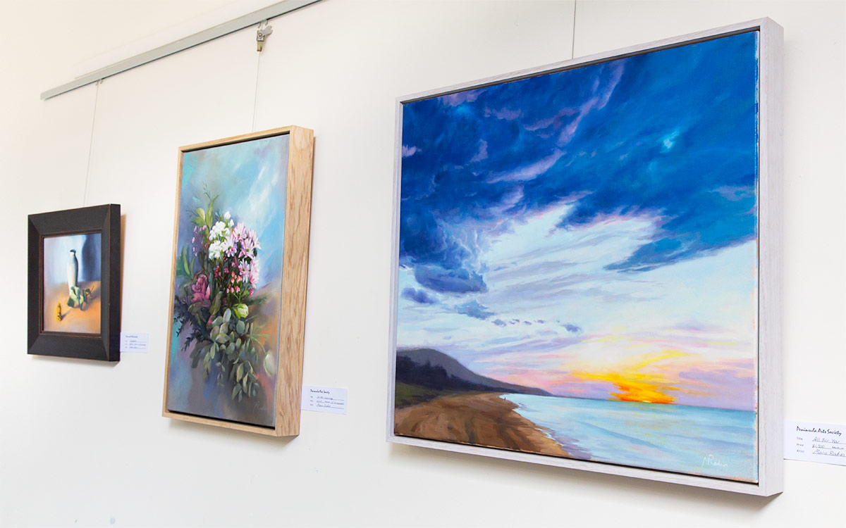 Photo of 3 artworks hanging in the Foyer Gallery.
