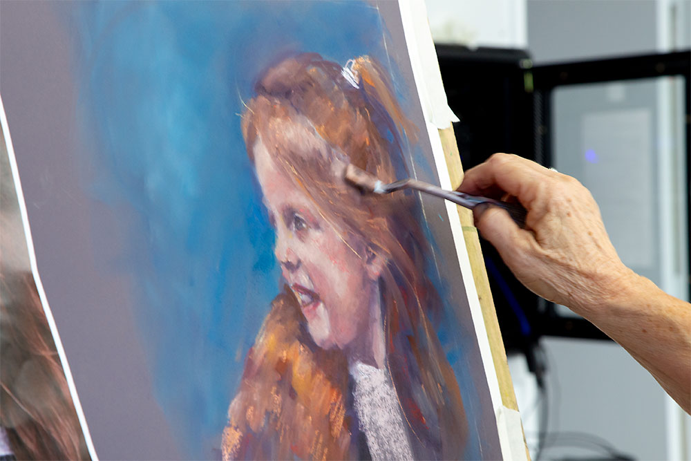 Adding colour hghlights to the girl's hair.