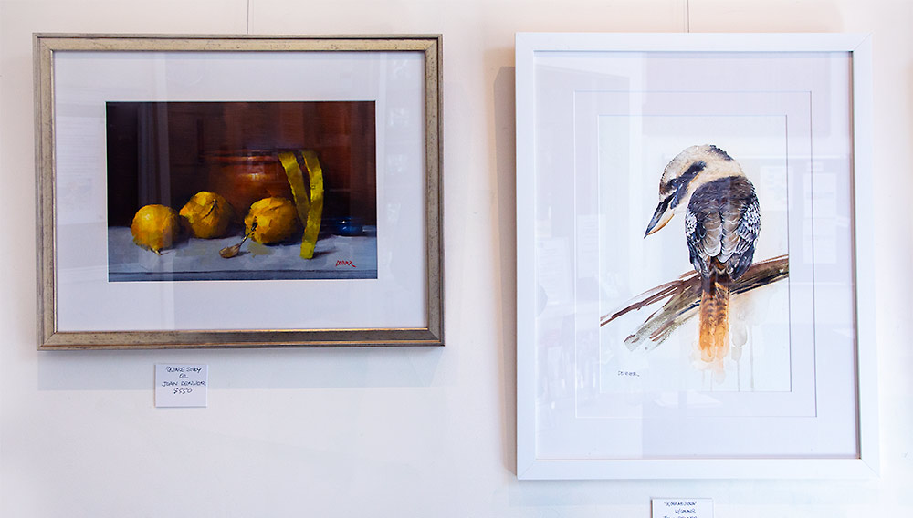 Artworks by Joan Denner Artworks by Joan Denner, one still life in oils featuring gold coloured quinces and the other a watercolour of a kookaburra.