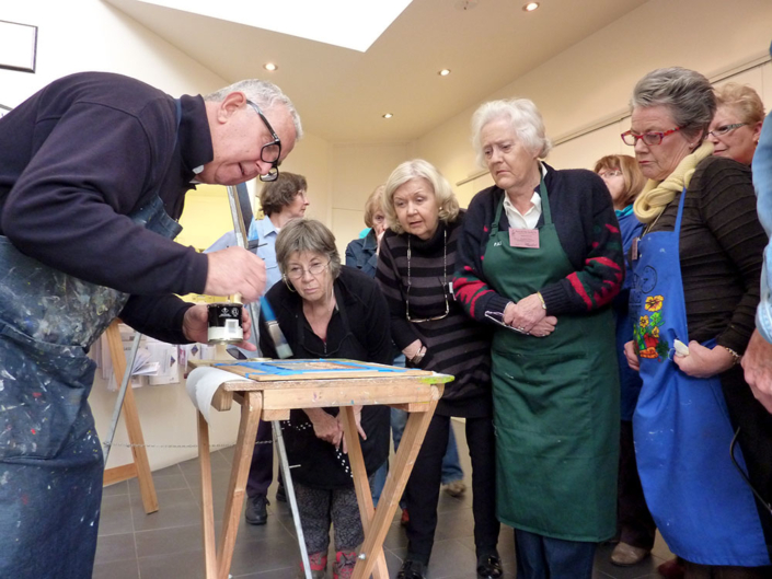 Colin Johnson teaching at PAS July 2012. Colin is demonstrating varnishing while students look on.