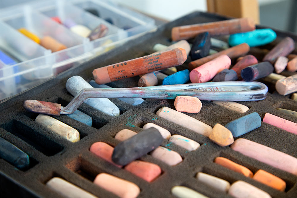 Pastel sticks and foam-tipped applicator