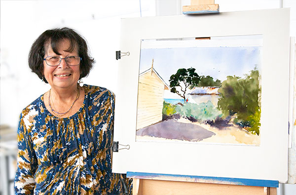 Annee Kelly with her partially completed painting.